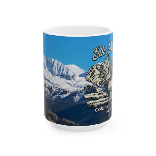 a mug with a picture of mountains and snow