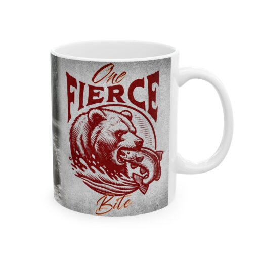 a white coffee mug with a bear and fish in it