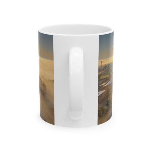 a white mug with a picture of a city