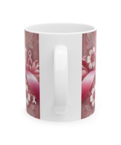 white coffee mug with pink ribbon and white handle