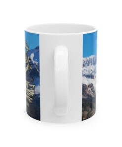 a white mug with a picture of a mountain