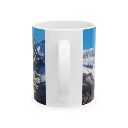 a white mug with a picture of a mountain