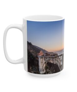 a white coffee mug with a bridge on it