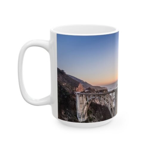 a white coffee mug with a bridge on it