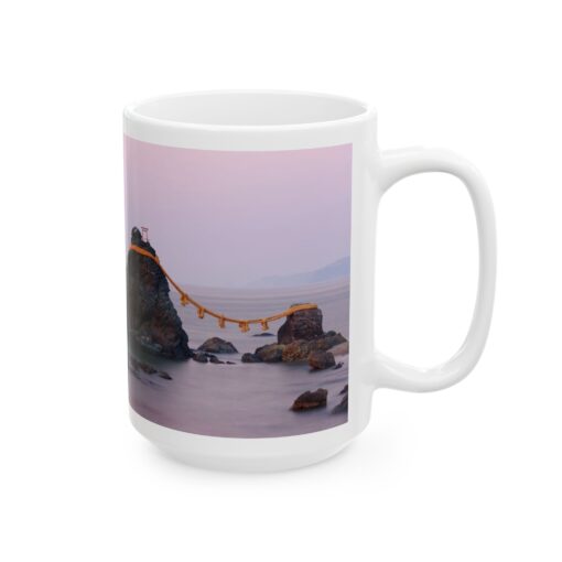 a white coffee mug with a picture of a rock and a rope