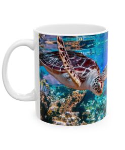 a white mug with a turtle swimming in the water