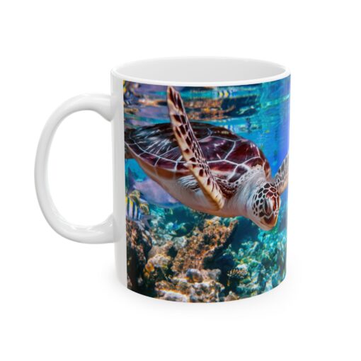 a white mug with a turtle swimming in the water