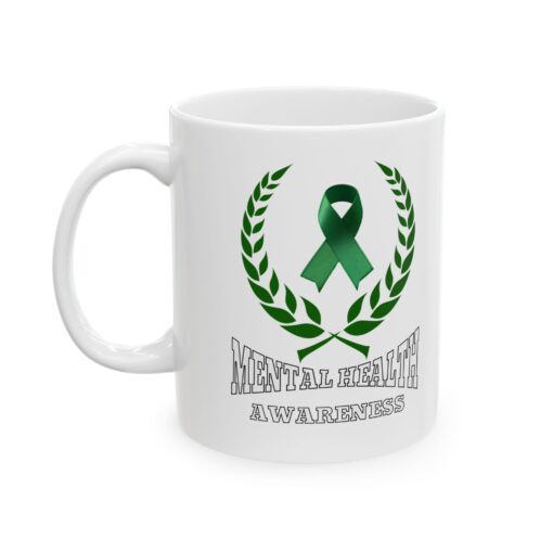 White ceramic mug with a green ribbon, laurel wreath, and the text "Mental Health Awareness."