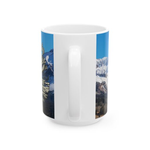 a white mug with a picture of mountains