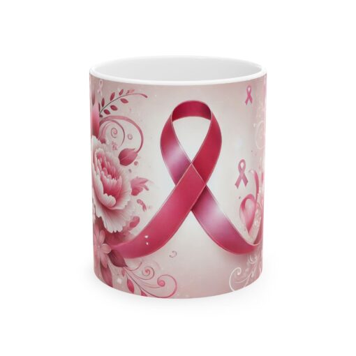 white coffee mug with big pink ribbon on it