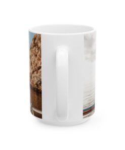 a white coffee mug with a picture of a rock on it