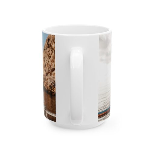 a white coffee mug with a picture of a rock on it