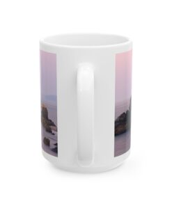 a white coffee mug with a picture of a beach