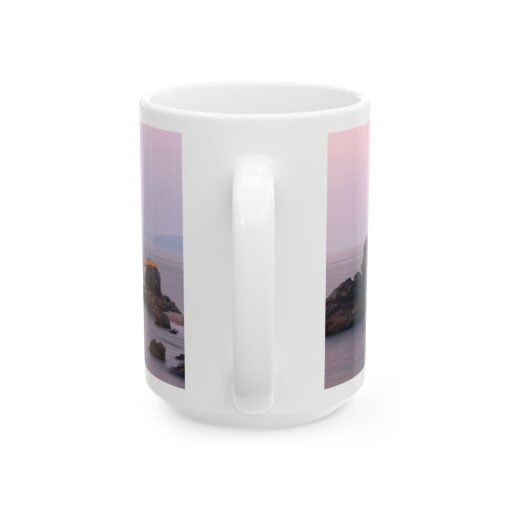 a white coffee mug with a picture of a beach