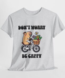 a white t-shirt with a cartoon character riding a bicycle