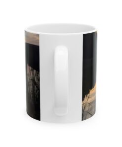 a white coffee mug with a black and white photo of a tree