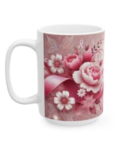 a white coffee mug with pink flowers and ribbons