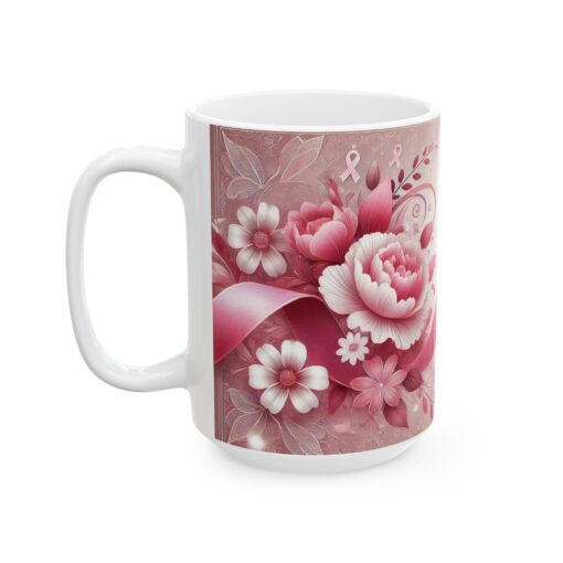 a white coffee mug with pink flowers and ribbons