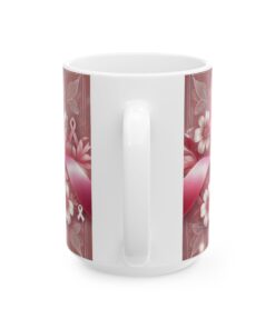 a white coffee mug with a pink design