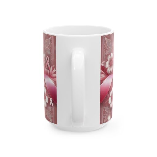 a white coffee mug with a pink design