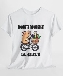 a white t-shirt with a cartoon character riding a bicycle