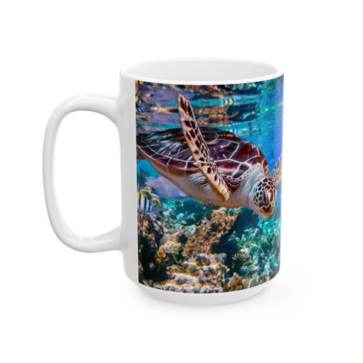 a white mug with a turtle swimming in the water