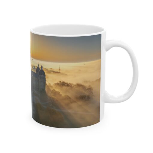 a white coffee mug with a capital building on it