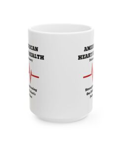 a white mug with black text and red words