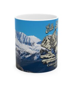 a mug with a picture of mountains and snow