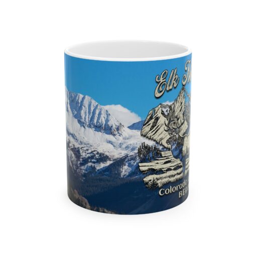 a mug with a picture of mountains and snow