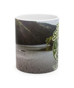 a coffee mug with a image of a man fishing on a lake