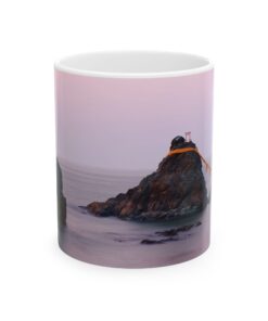 a coffee mug with a picture of Wedded Rocks of Futami on it