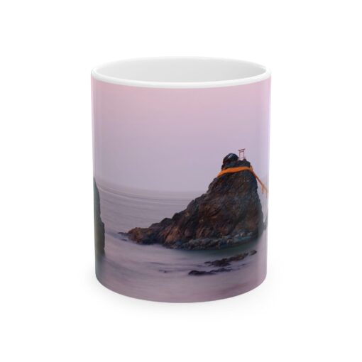 a coffee mug with a picture of Wedded Rocks of Futami on it