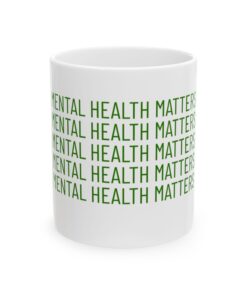 a white mug with green text on it