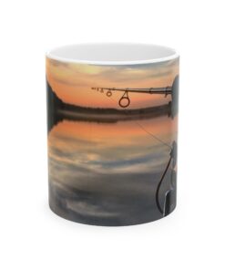 a coffee mug with a fishing pole and a sunset