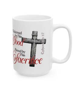 a white mug with a cross and words