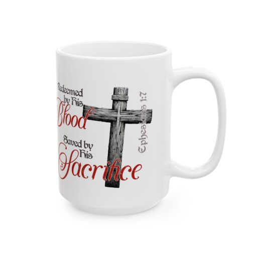 a white mug with a cross and words