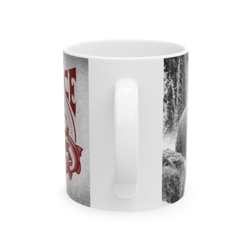 a white coffee mug with a red and black image