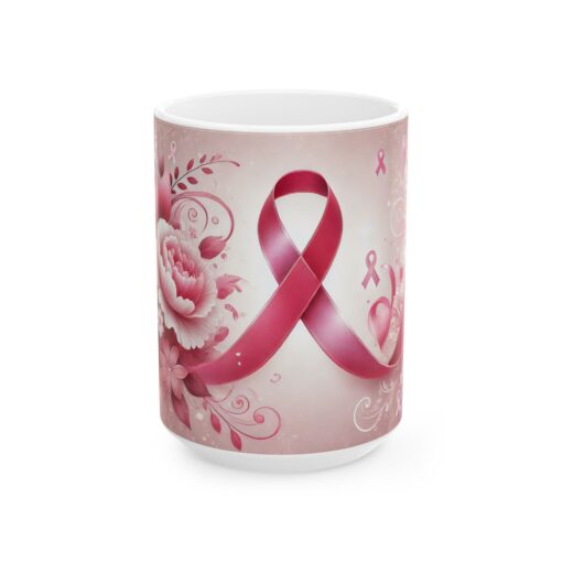 a mug with a pink ribbon on it