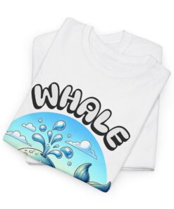 a folded white t-shirt with a whale design