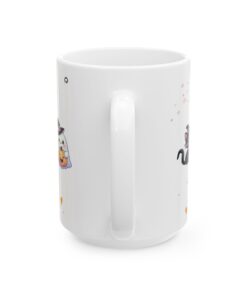 a white mug with cartoon cats on it