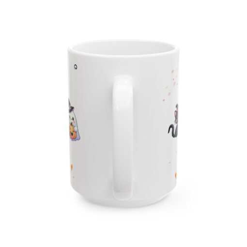 a white mug with cartoon cats on it