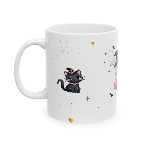 a white mug with cartoon cats on it