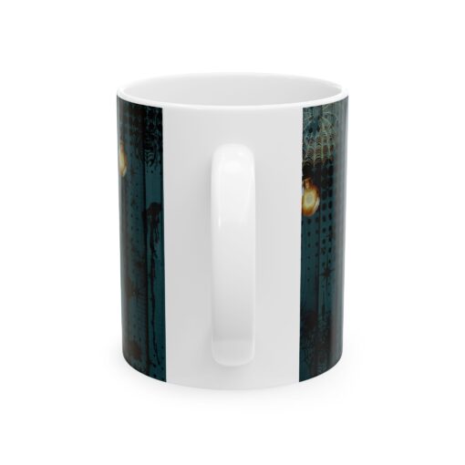 a white mug with a blue design on it